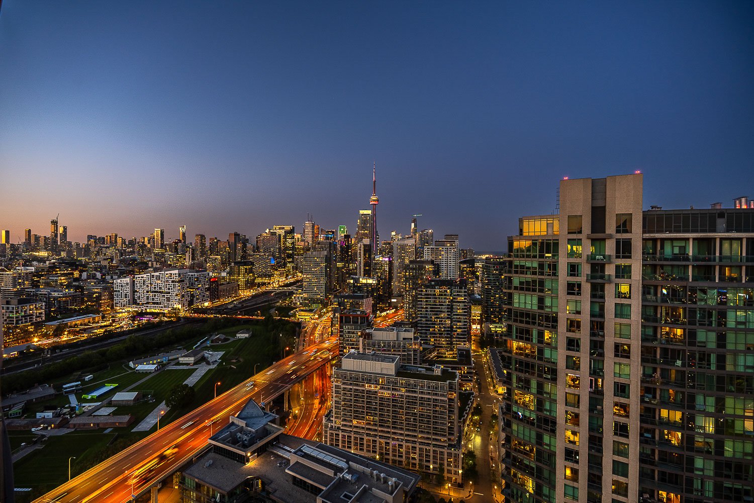 Twilight aerial view of the Toronto skyline with the CN Tower and illuminated city lights