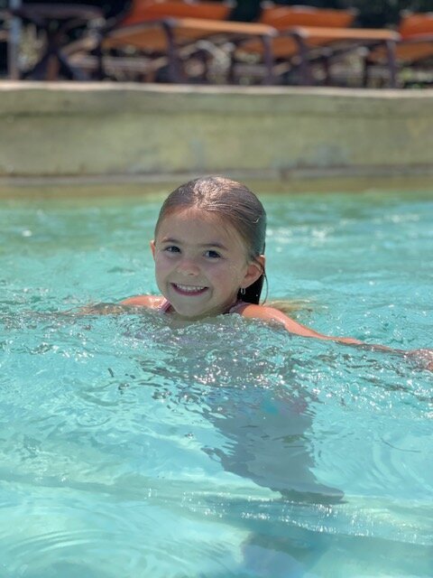 little girl swimming pool