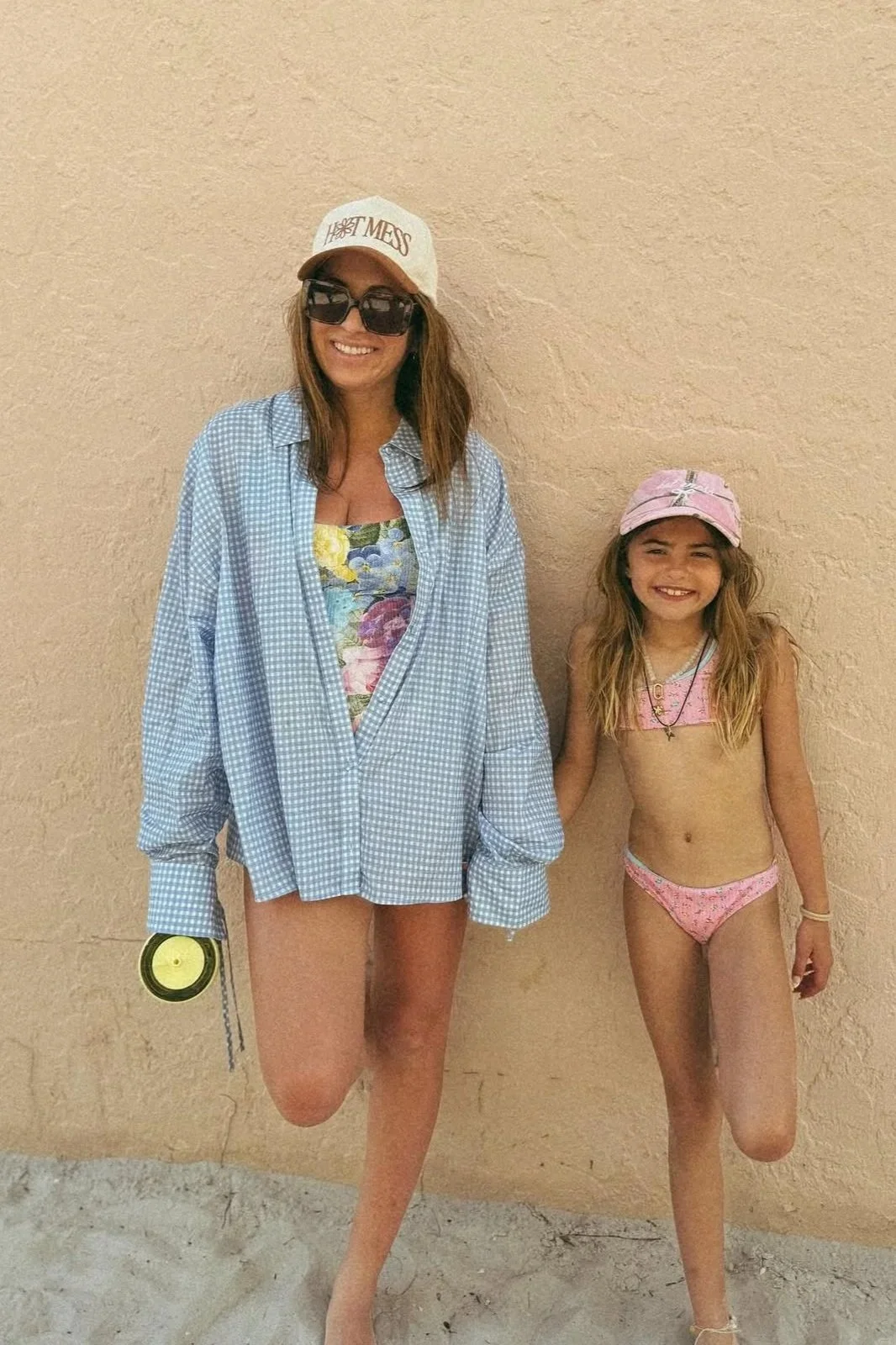 photo of krista kolly on the beach against a tan wall