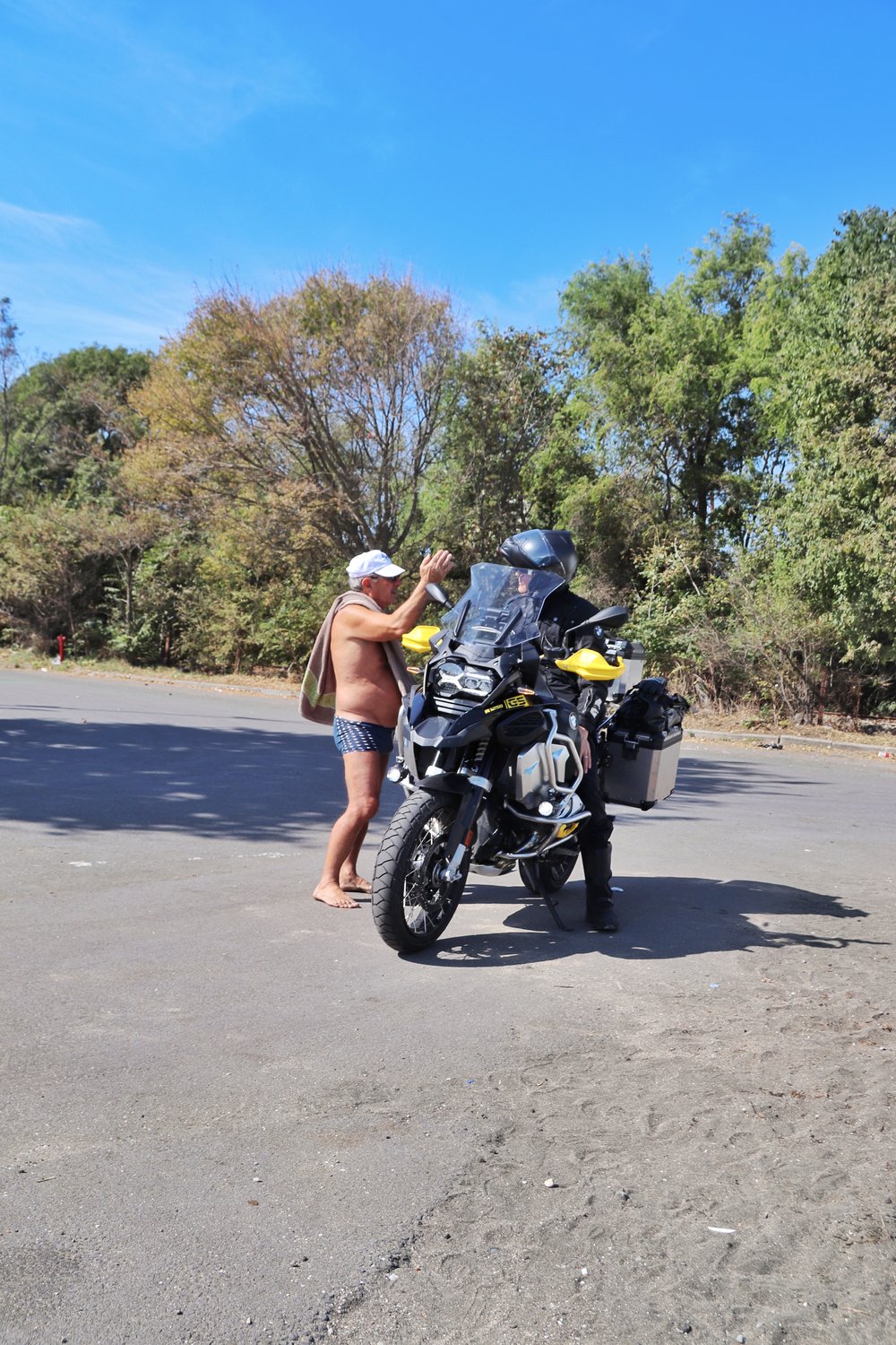 motorcycle beach talking with locals BMW R1250 GS stories 