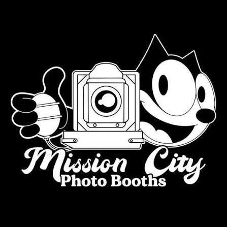 Logo for Mission City Photo Booths featuring a cartoon cat holding a camera and giving a thumbs-up.