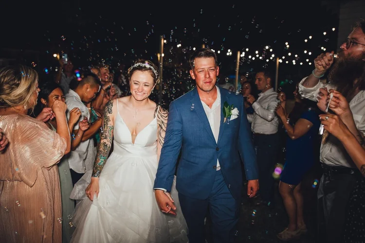 Couple's sparkler exit at night