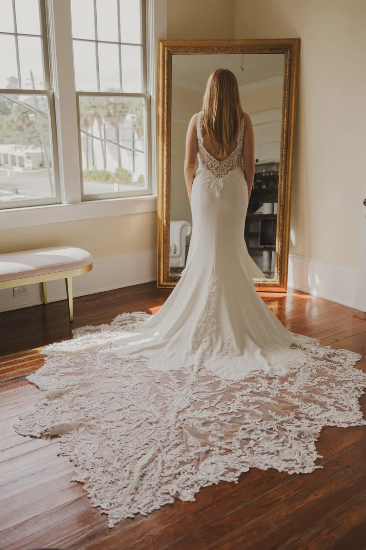 Bride in her gown in the bridal suite