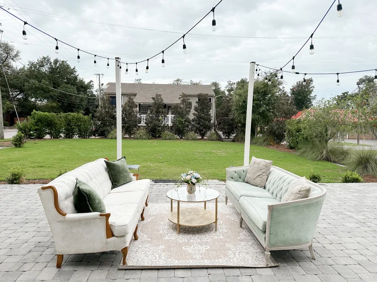 Outdoor lounge seating under string lights