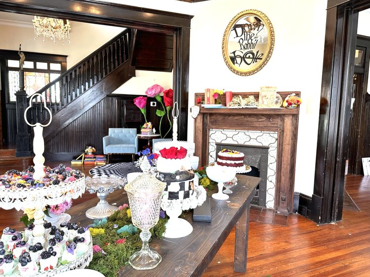 Dessert and fireplace mantle inside The Sapp House