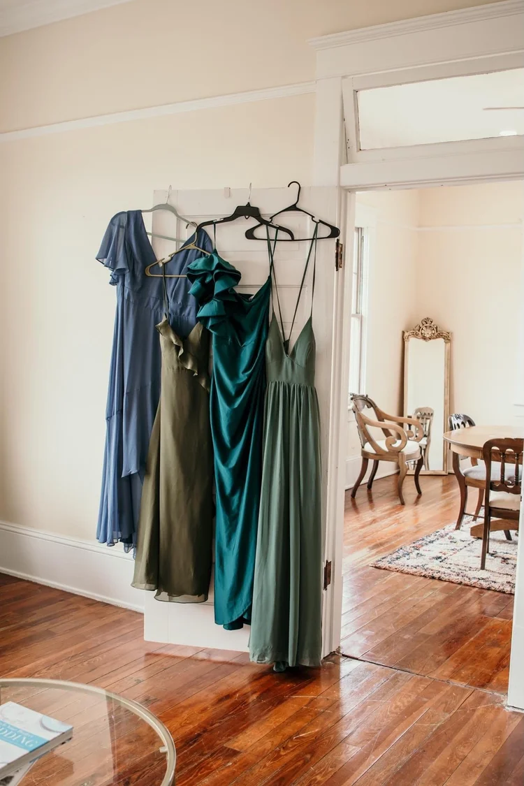Bridesmaid dresses hanging in the bridal suite