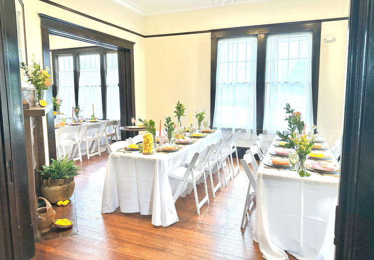 Long reception table in a sunlit gathering room