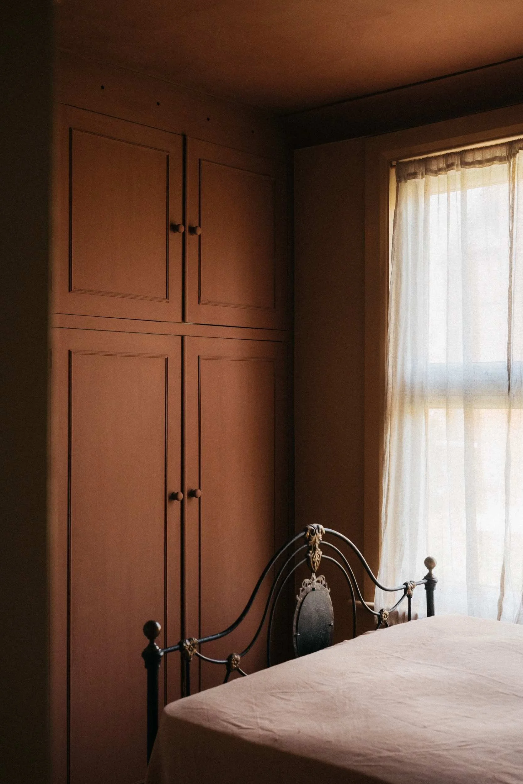 Cupboard painted in Atelier Ellis' Fletton (faded brick red).