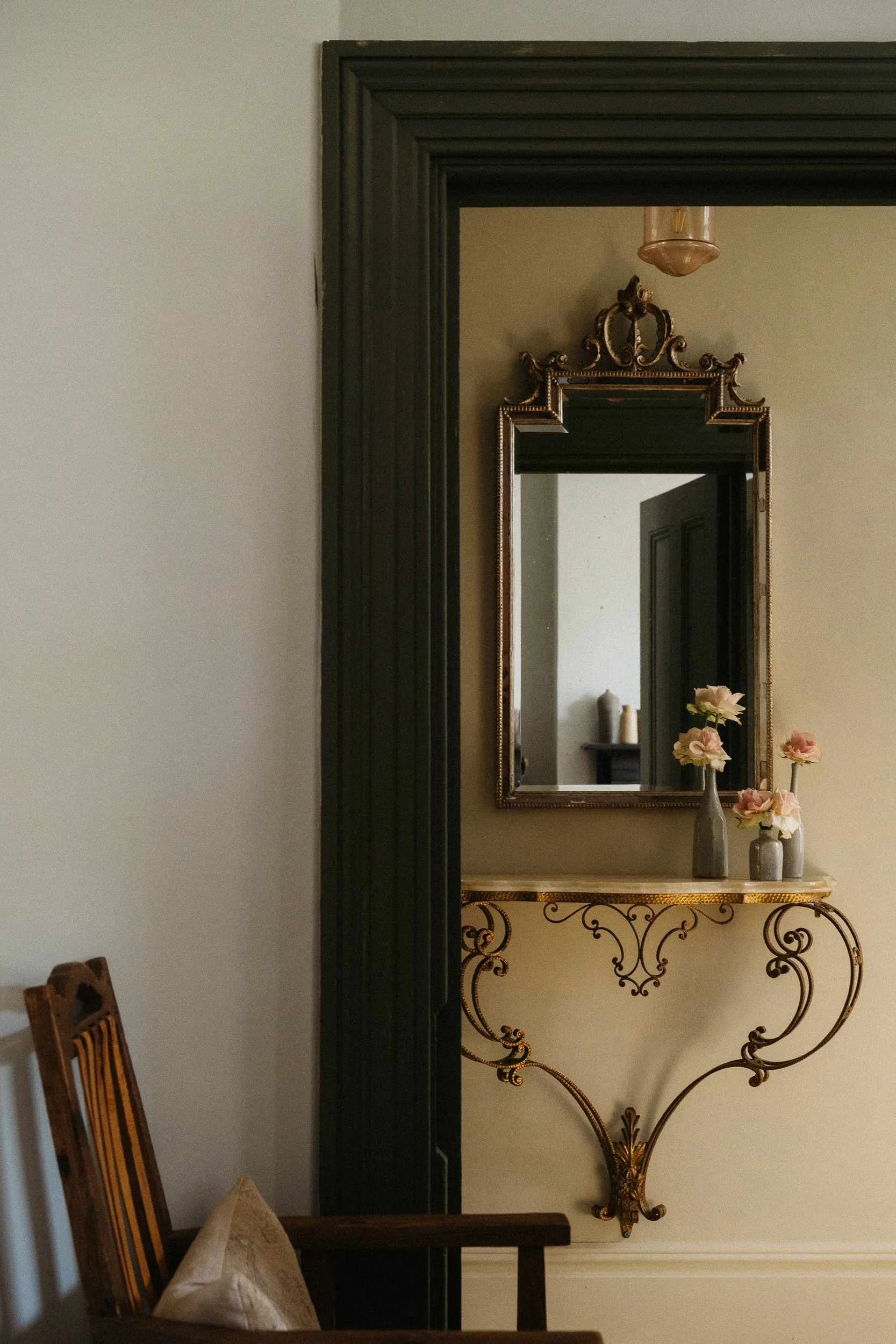 Hallway painted in Atelier Ellis' They Rise Up (pale yellow). Door painted in Emily (dark green).