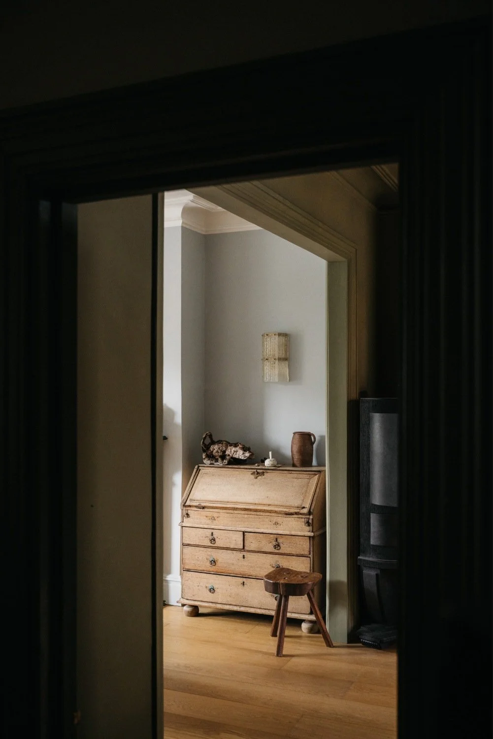 Living room painted in the breathable paint colours I Went Outside and Is-land, a pale blue and an olive green.