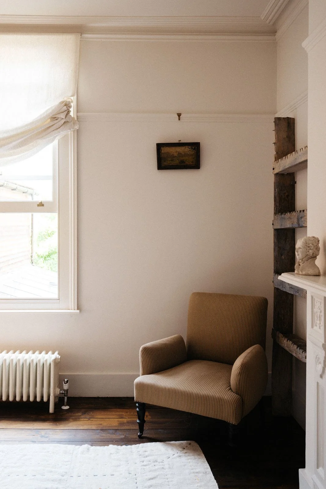 Chair in ta room corner at 'The Grove', Merchant & Mills' sewing residency. The walls behind it are painted in Atelier Ellis Milk.