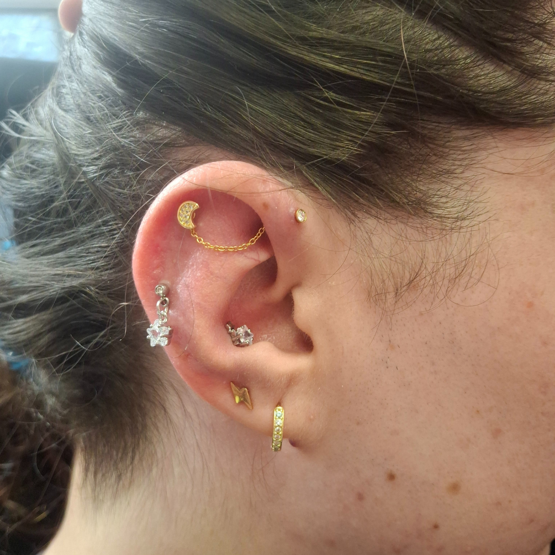 Piercings with Genevieve Piercings professional piercer qualified piercer curated ear specialist ear piercings nostril piercings nipple piercings jewellery styling discoballxgenevieve piercing jewellery piercing party group booking children and teen