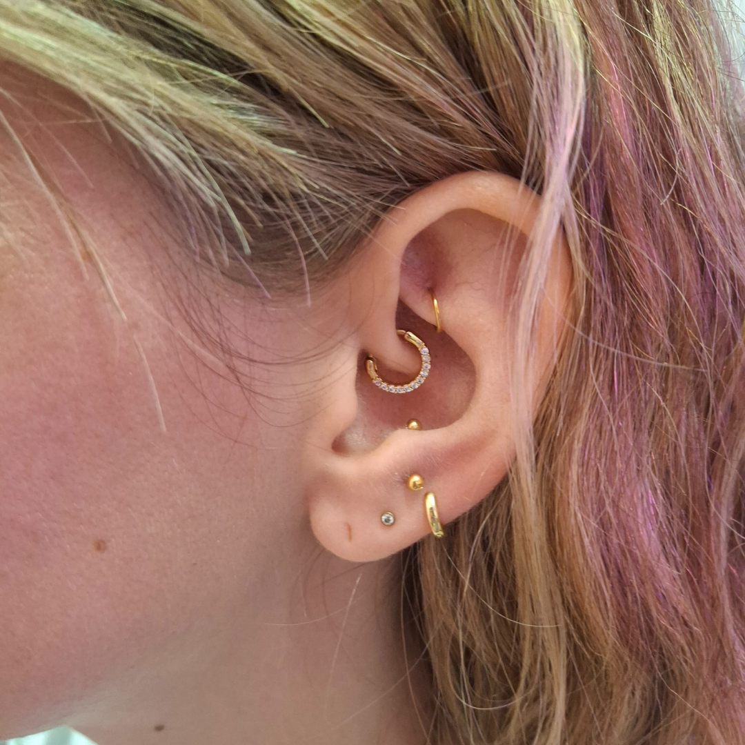 Piercings with Genevieve Piercings professional piercer qualified piercer curated ear specialist ear piercings nostril piercings nipple piercings jewellery styling discoballxgenevieve piercing jewellery piercing party group booking children and teen