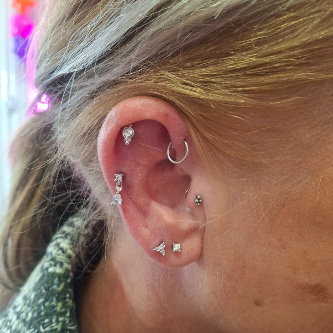 Piercings with Genevieve Piercings professional piercer qualified piercer curated ear specialist ear piercings nostril piercings nipple piercings jewellery styling discoballxgenevieve piercing jewellery piercing party group booking children and teen