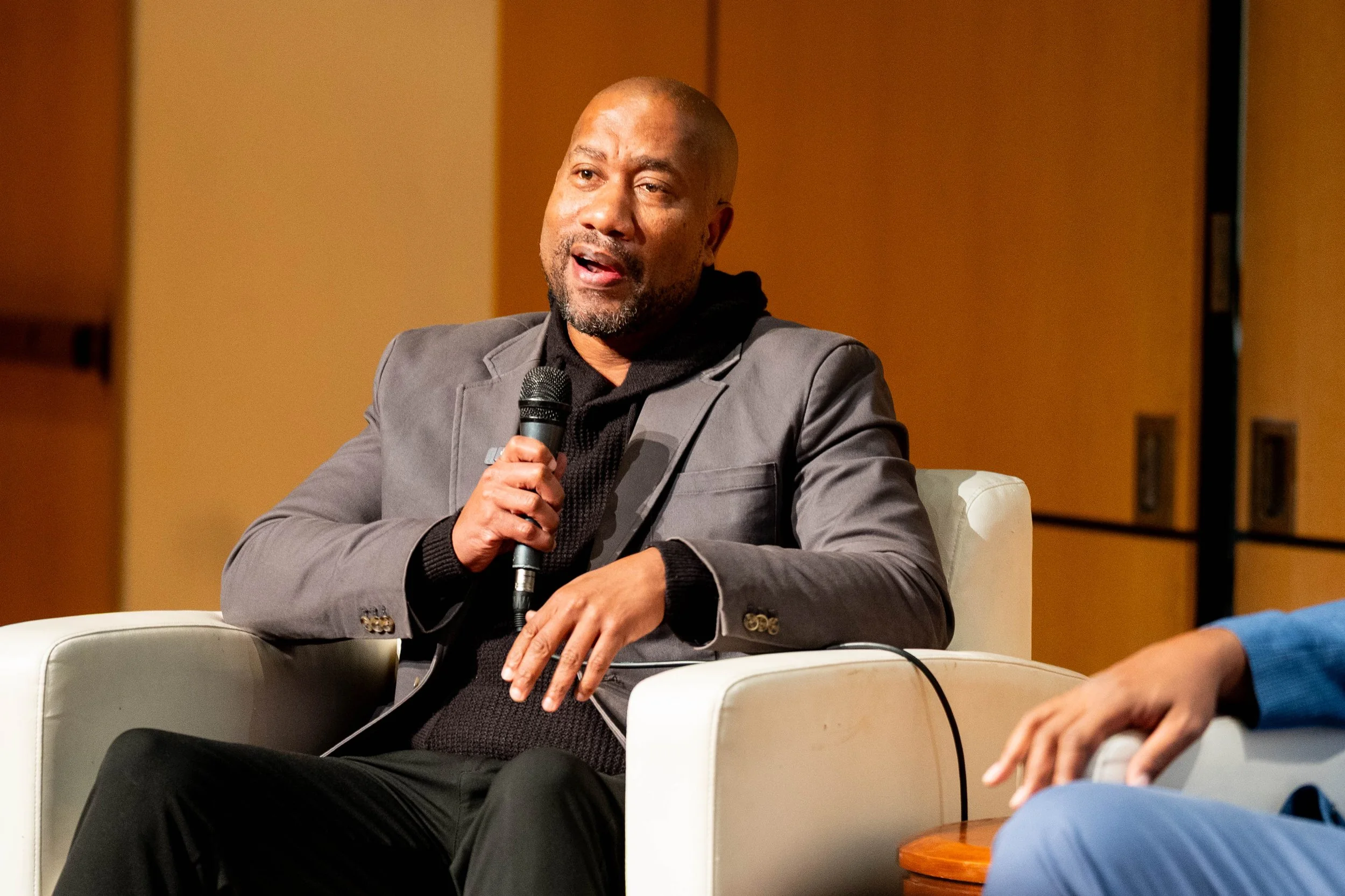  Damion Thomas, PhD, speaks as part of the panel event.  