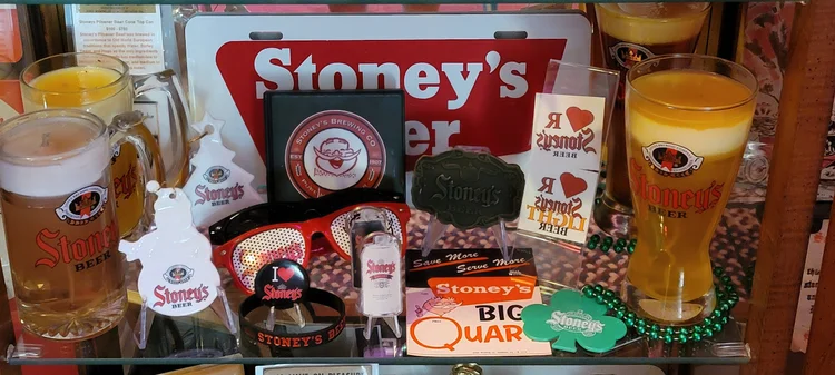 Stoney's beer mug, trays, and labels with a Big Quart can