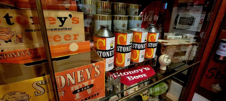 Shelf of vintage Stoney's flat-top and cone-top cans