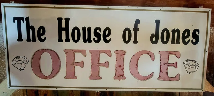 Vintage tin sign reading The House of Jones Office