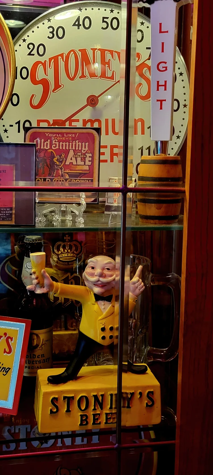 Stoney's thermometer sign beside a Mr. Smoothie cutout