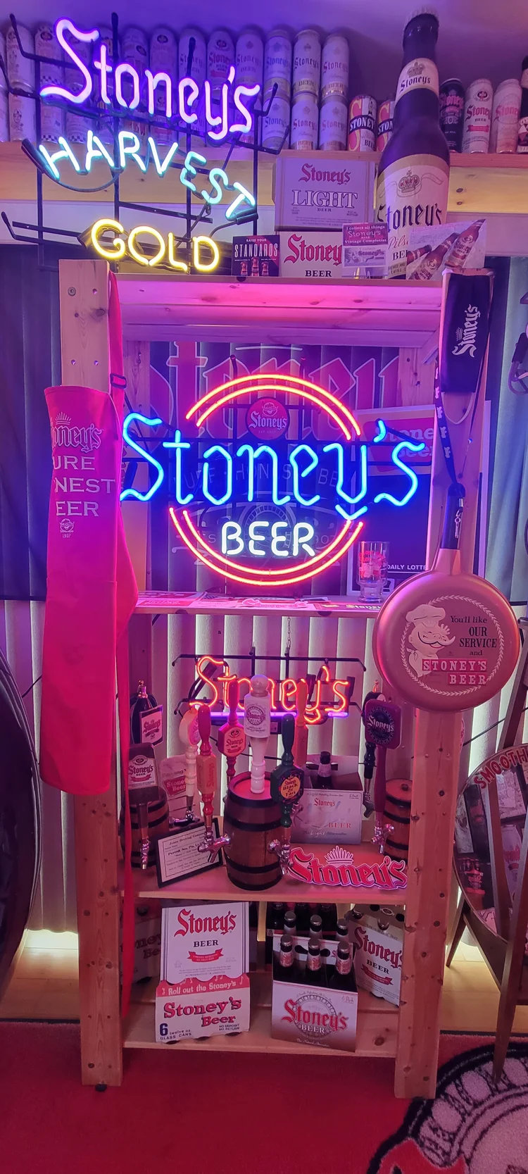 Stoney's Harvest Gold neon sign over a lit display