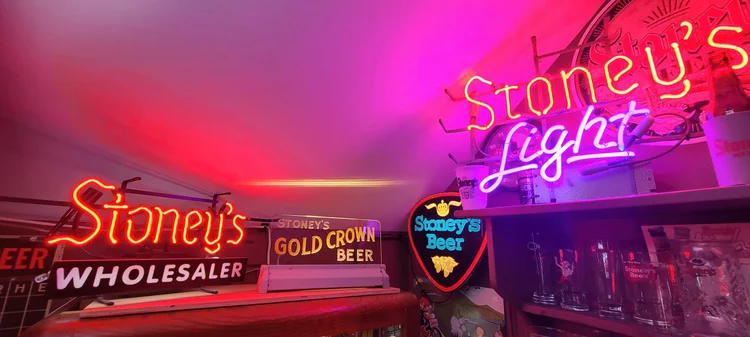 Stoney's Light and Wholesaler neon signs glowing pink