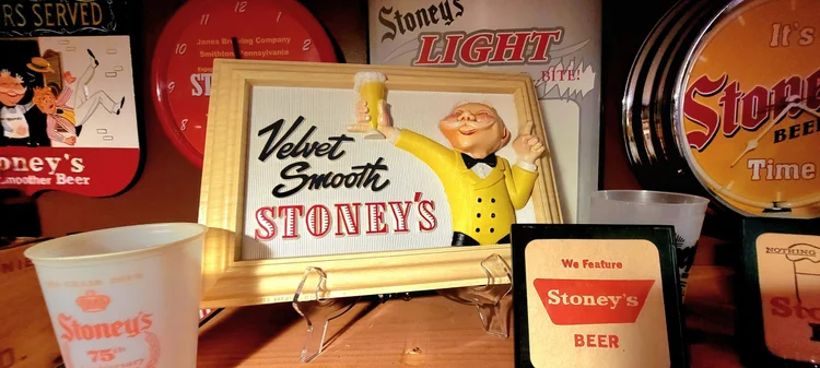 Velvet Smooth Stoney's sign with a Mr. Smoothie figure
