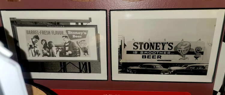 Framed black-and-white Stoney's photo prints on a wall
