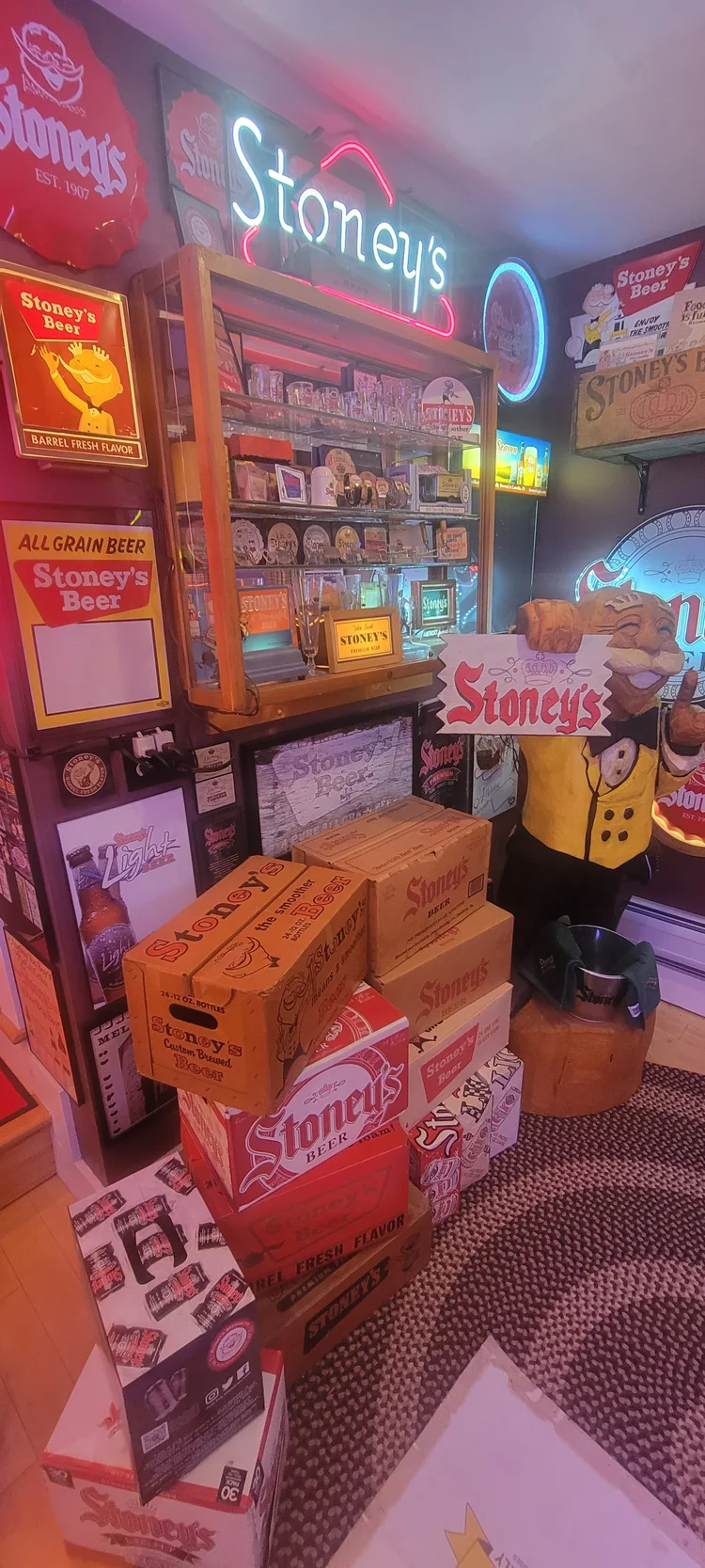 Collection room with Stoney's signs and stacked crates