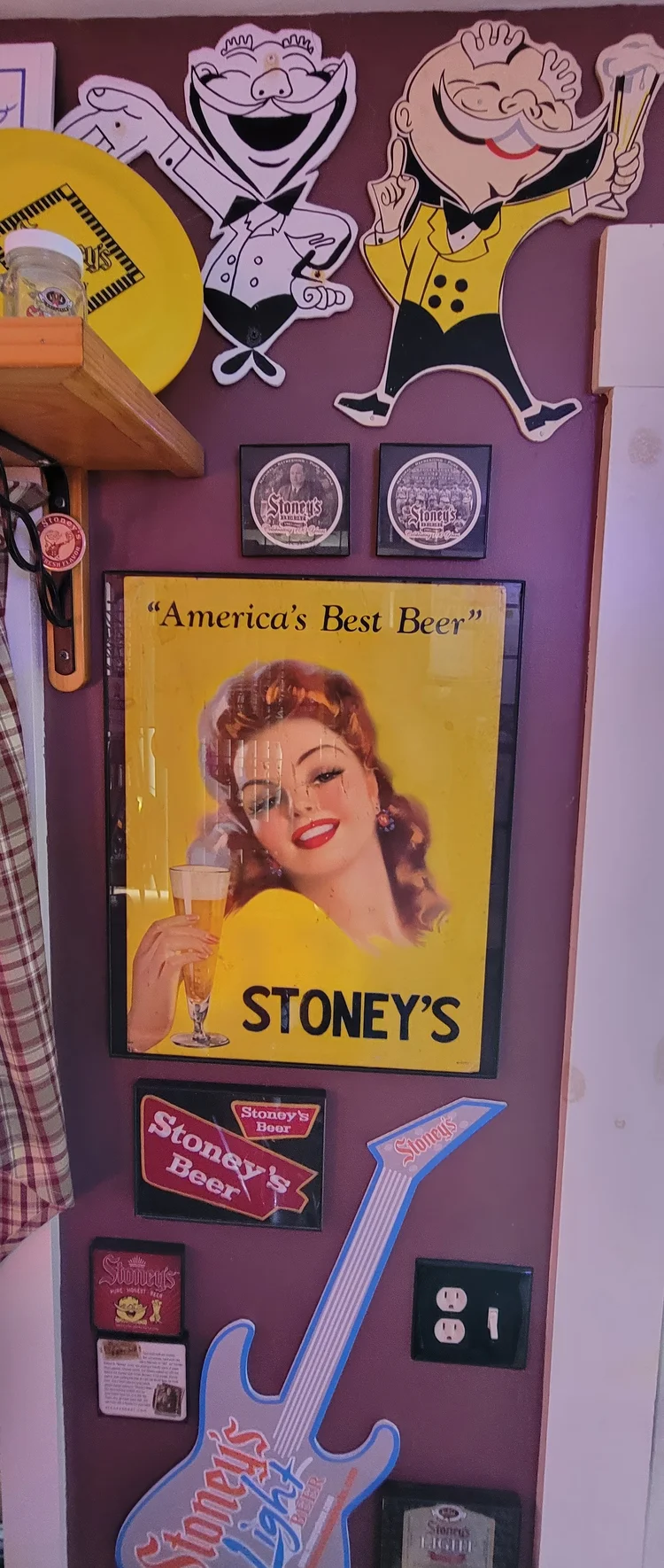 America's Best Beer Stoney's pin-up sign mounted on a door