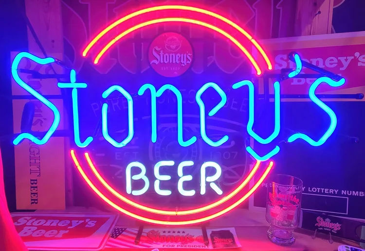 Neon Stoney's Beer sign glowing blue and orange