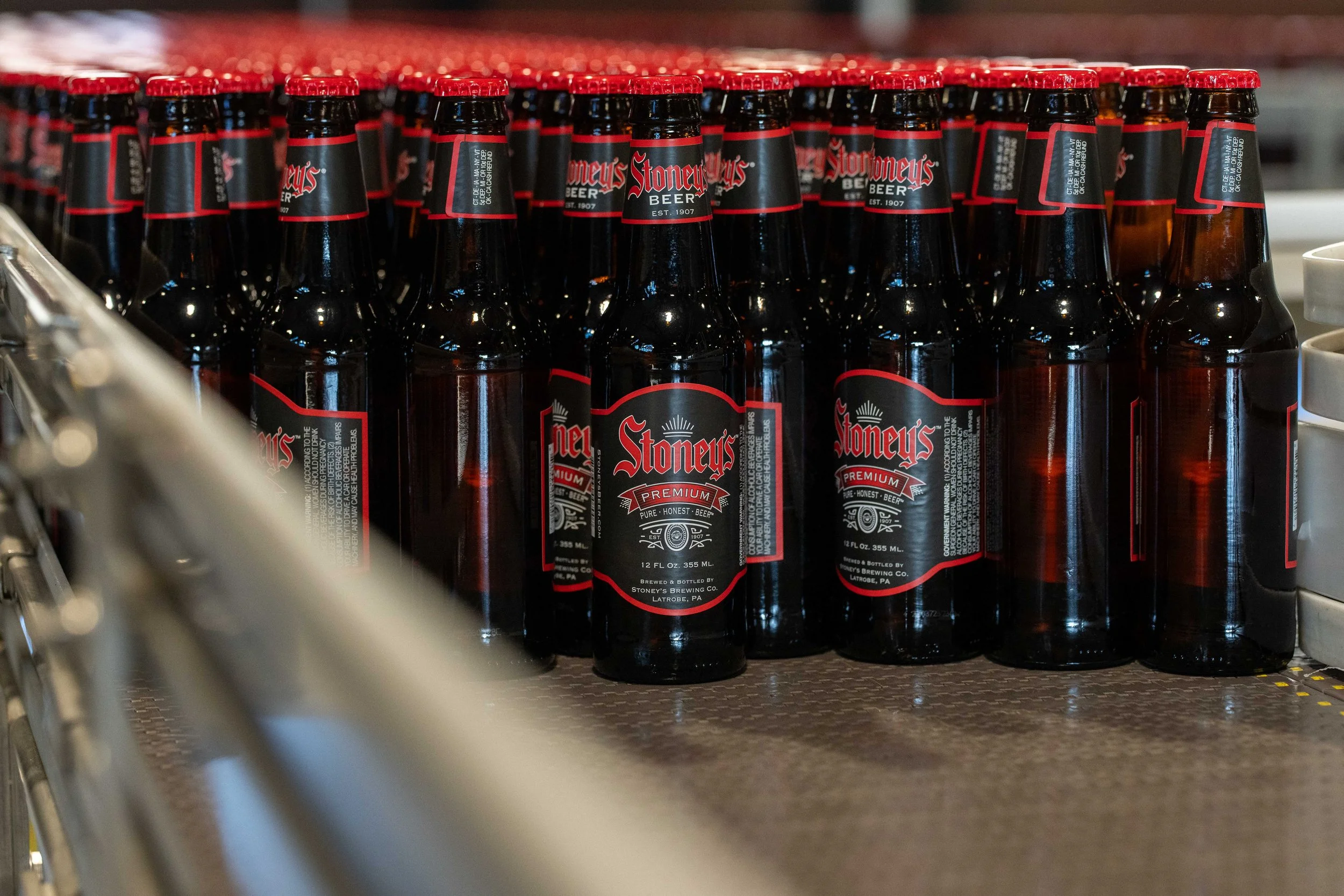 Stoney's Premium bottles on brewing production line pure honest beer brewed in Pennsylvania