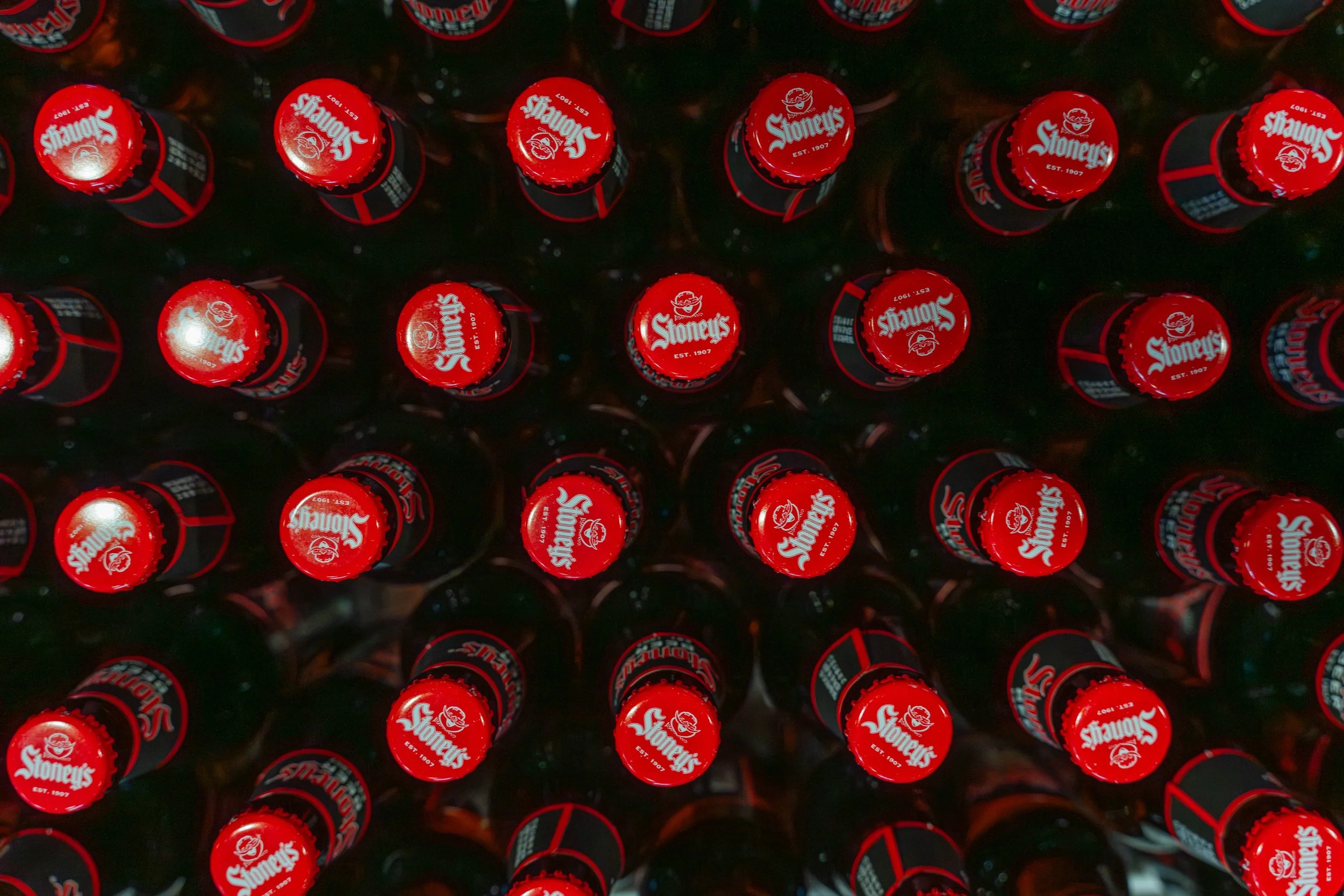 Stoney's Beer red bottle caps est 1907 overhead view brewed naturally in Pennsylvania
