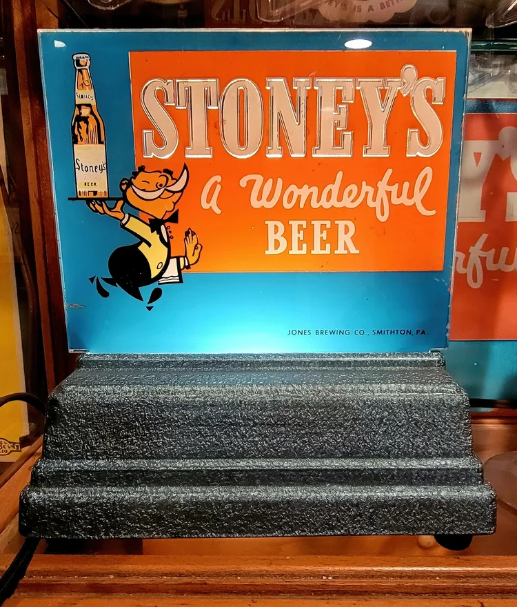 Stoney's A Wonderful Beer sign with a Mr. Smoothie figure