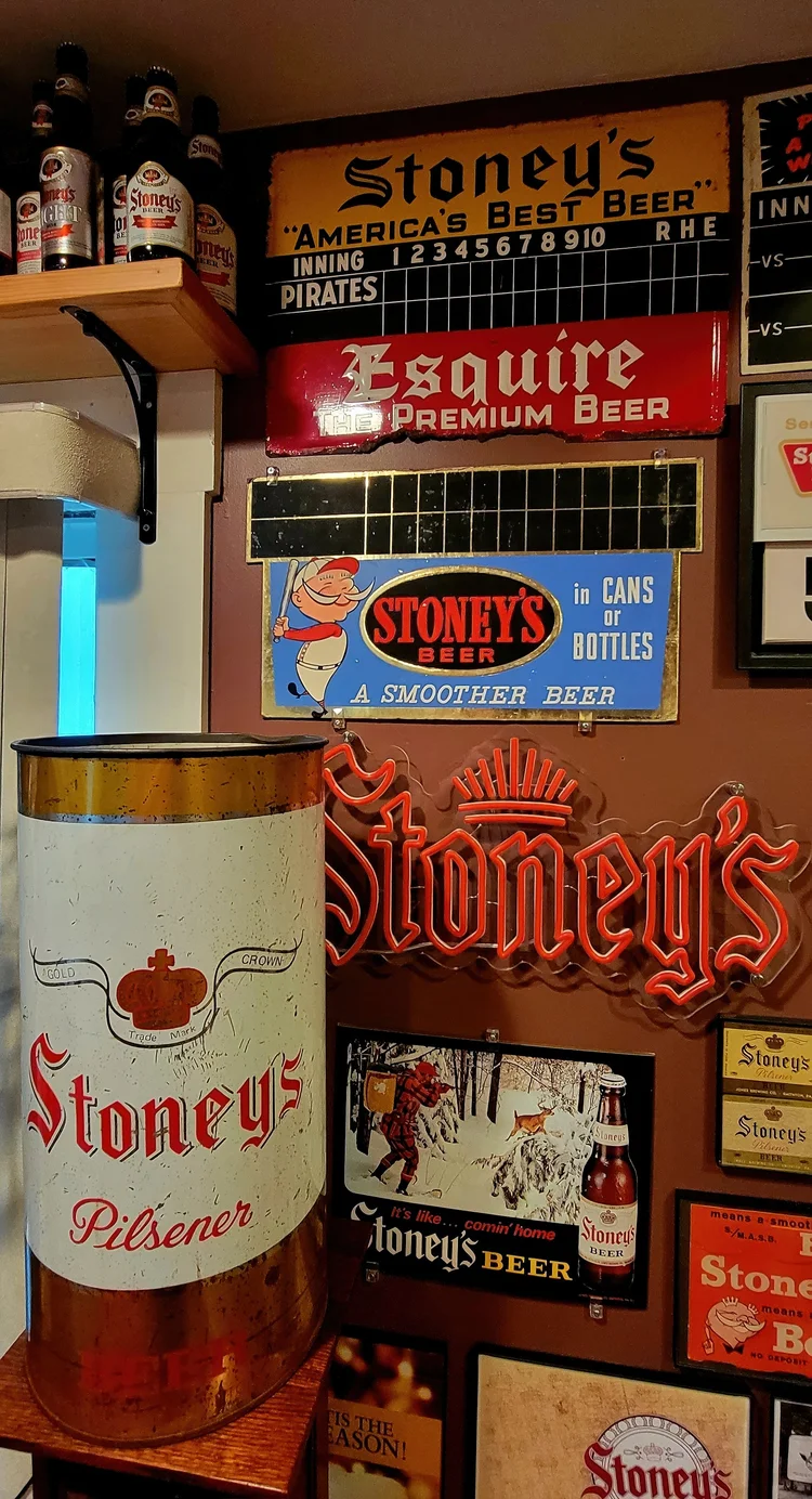 Stoney's Pilsener bottle sign over a stocked shelf