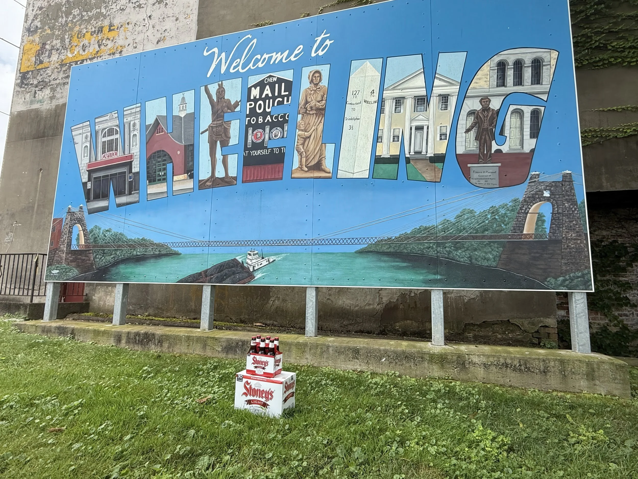 Case of Stoney’s Beer placed in front of the Welcome to Wheeling mural in West Virginia