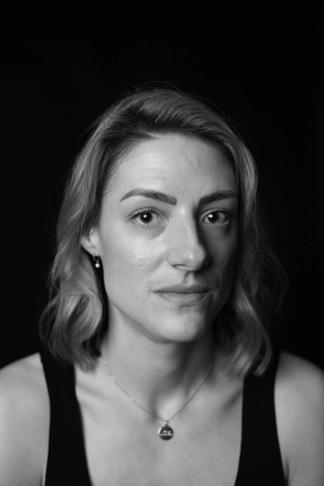 Monochrome photograph portrait of a woman sufferer of Hyperemesis Gravidarum produced by photographer Clare Hughes.