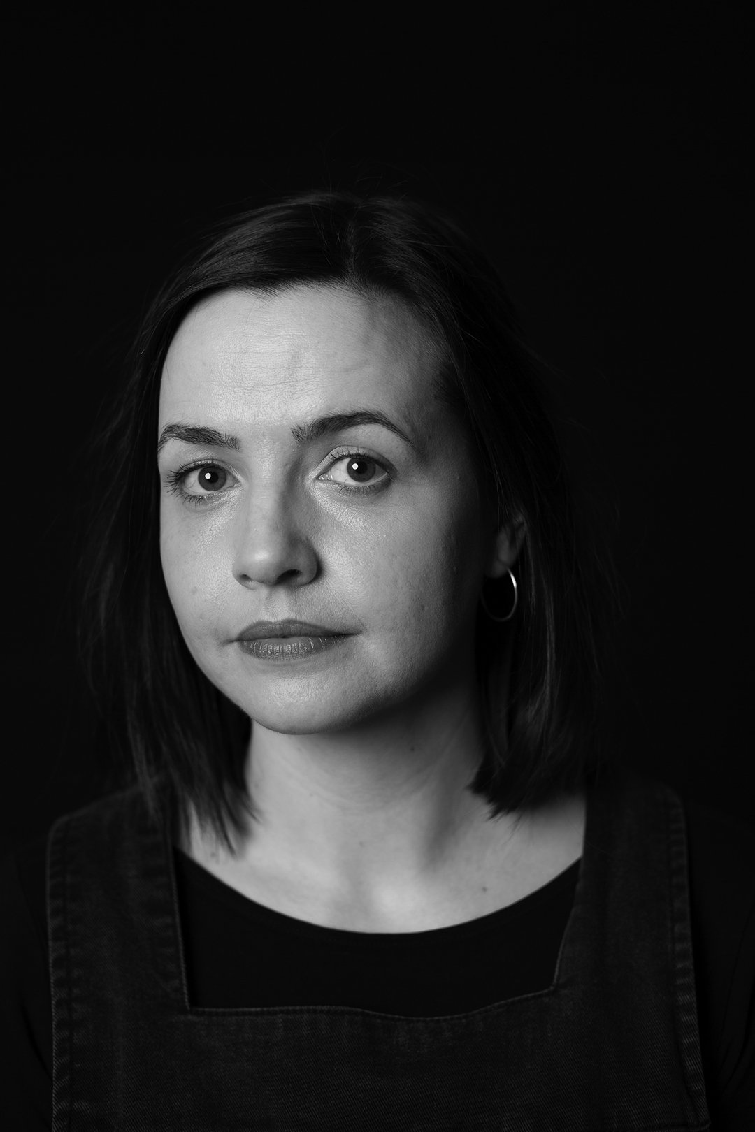 Monochrome photograph portrait of a woman sufferer of Hyperemesis Gravidarum produced by photographer Clare Hughes.