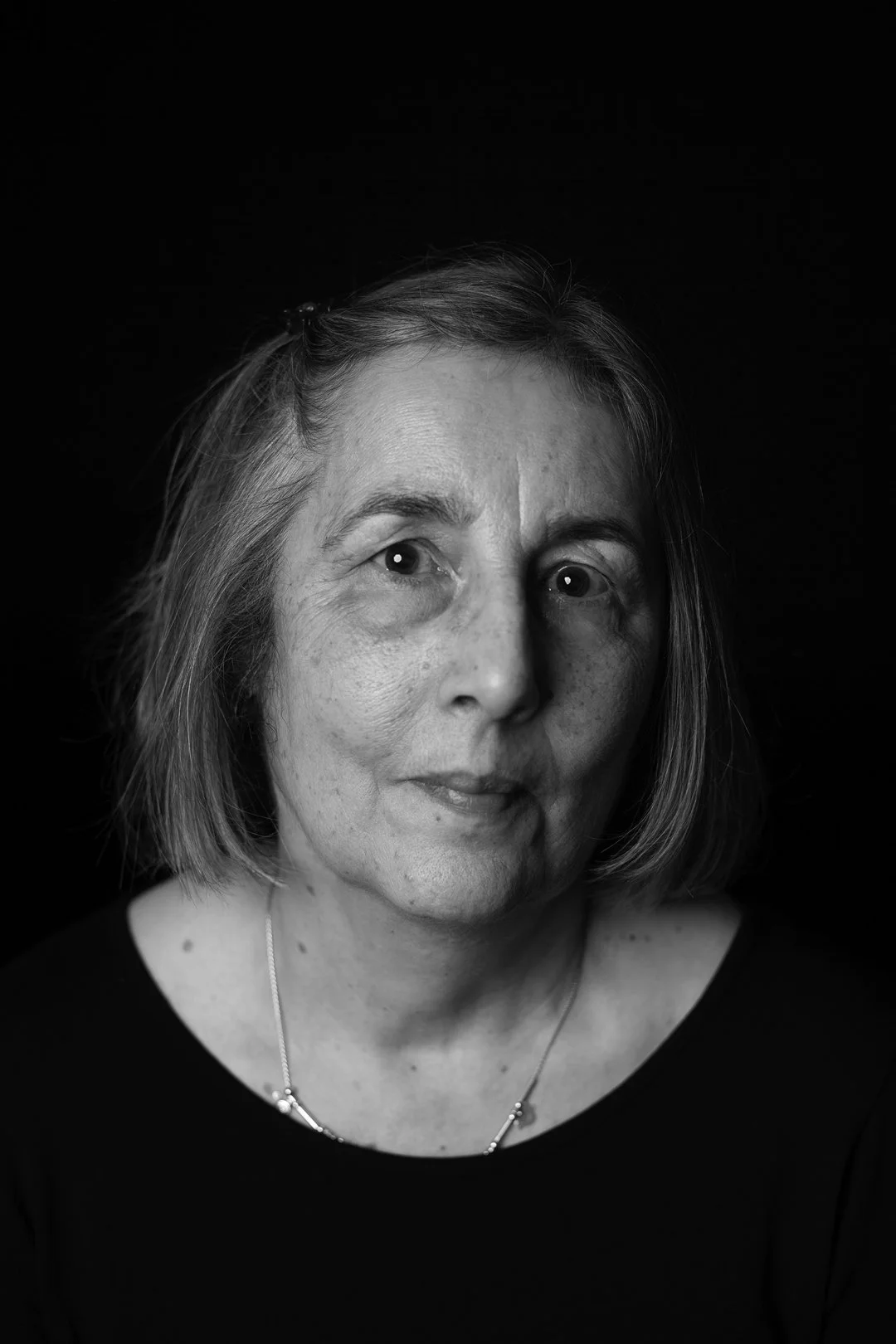 Monochrome photograph portrait of a woman sufferer of Hyperemesis Gravidarum produced by photographer Clare Hughes.