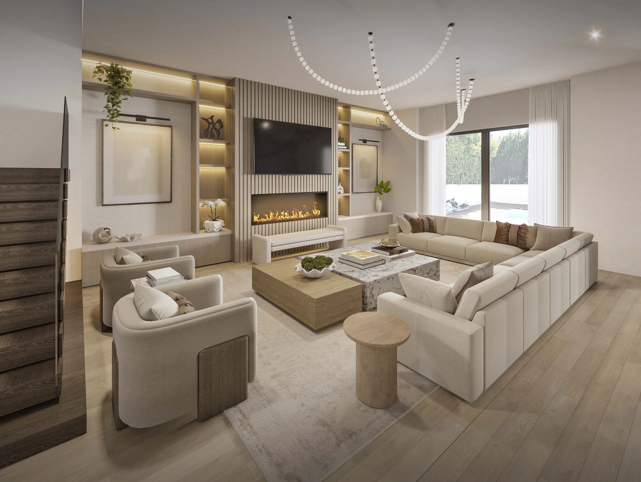 A spacious family room centered around a large sectional that invites comfort and gathering. A custom media wall with built-in cabinetry and a fireplace creates a warm focal point, while a statement chandelier adds a layer of sophistication. Clean li