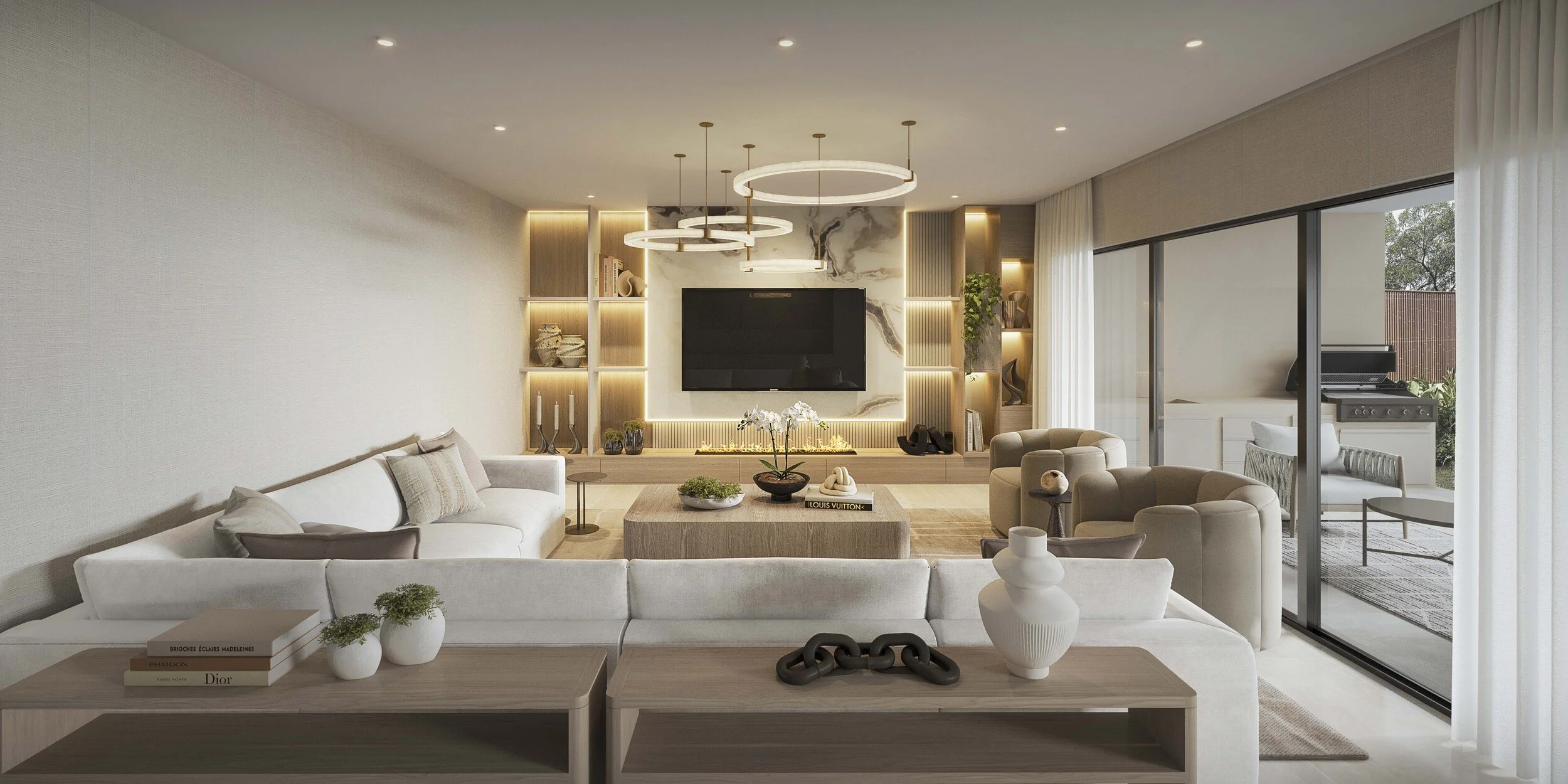 A bright open-concept living room featuring a custom stone media wall with integrated lighting as its focal point. Floor-to-ceiling glass doors enhance the indoor-outdoor connection, while soft neutrals and layered textures create a warm, modern luxu