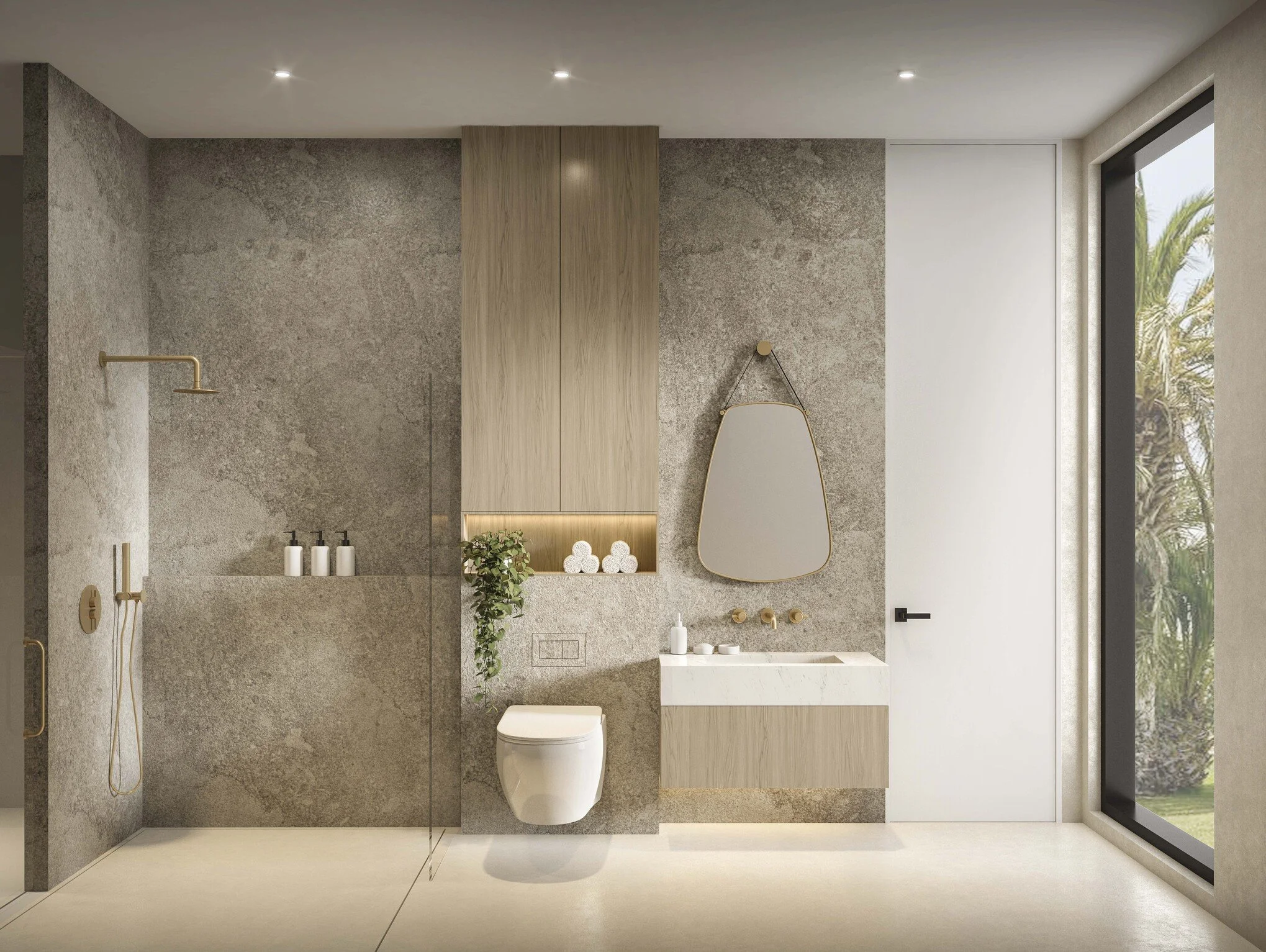 A modern bathroom featuring a grey accent stone wall that adds depth and texture to the space. Custom built-in storage behind the toilet enhances functionality while maintaining a clean, streamlined look, complemented by neutral tones and refined fin
