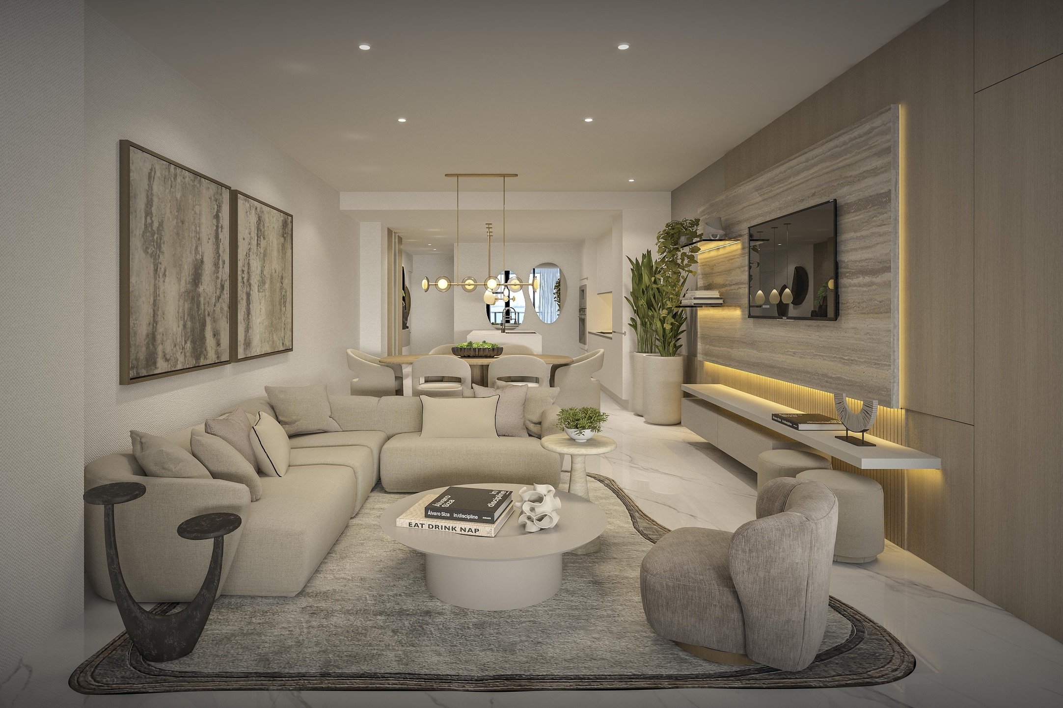 A contemporary living room featuring a sculptural curved sofa and an irregular area rug that add softness and movement to the space. A custom media wall with a stone accent creates a refined focal point, while layered textures and neutral tones enhan