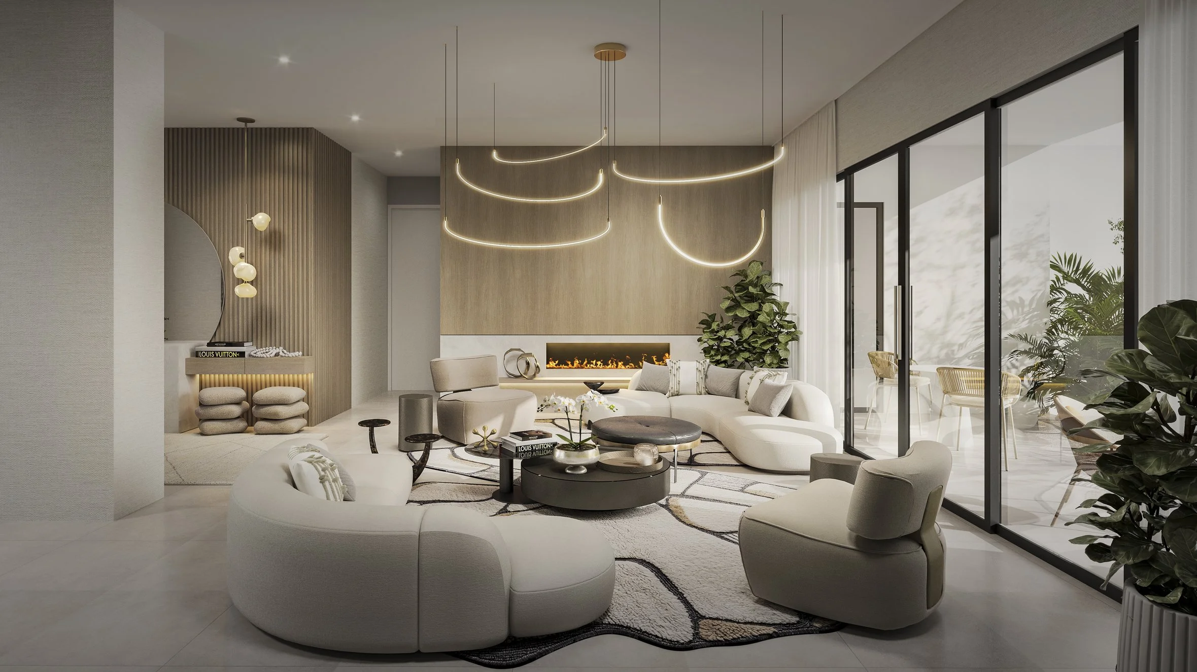 A sophisticated formal living room featuring sculptural curved sofas arranged around an irregular area rug that adds movement and softness to the space. A flowing statement chandelier and modern fireplace create elegant focal points, while round nest