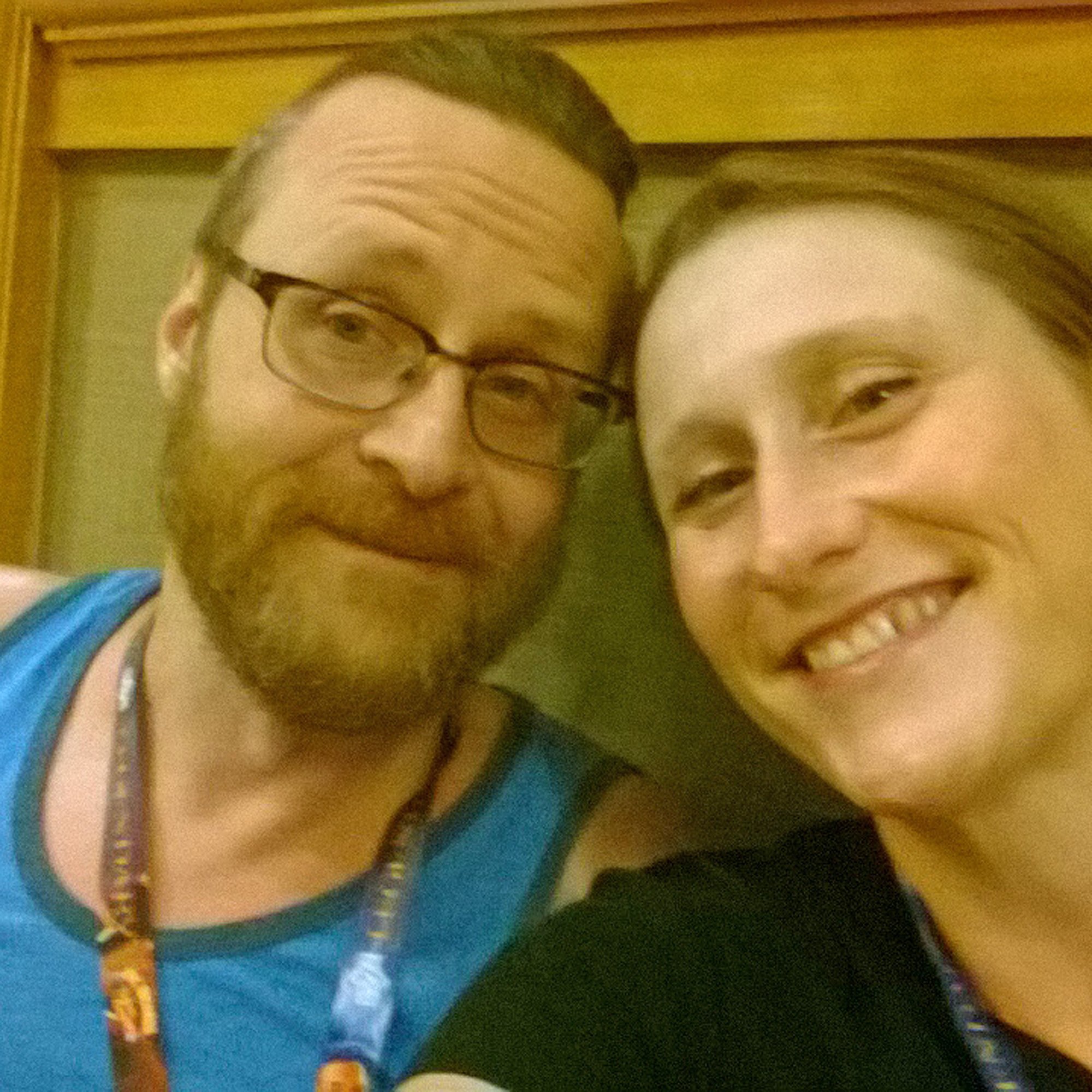Independent authors Michael R. Swanson & Amanda K. King smiling for a selfie at GenCon.