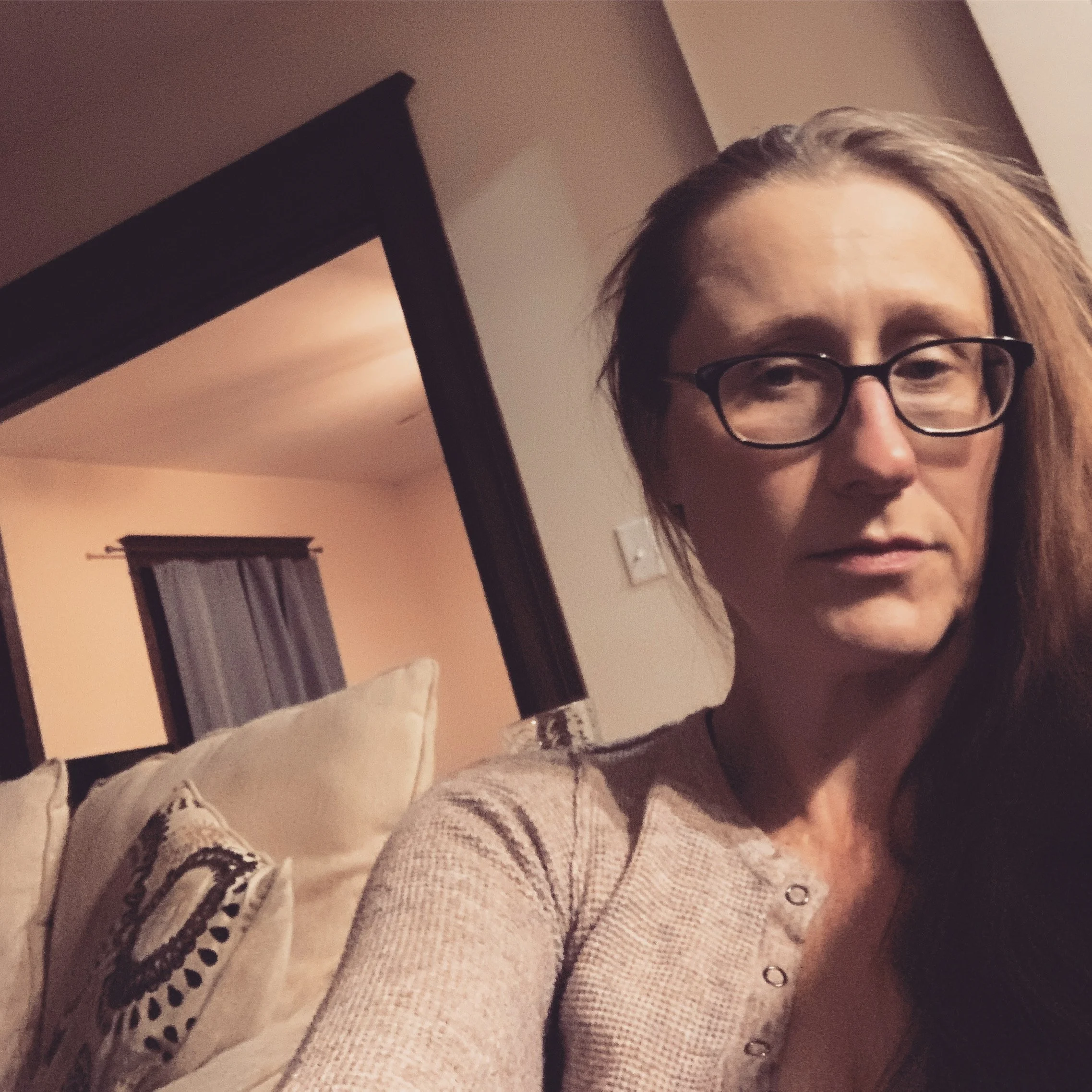 Amanda K. King, independent author of horror books, taking a selfie in an Air BnB.