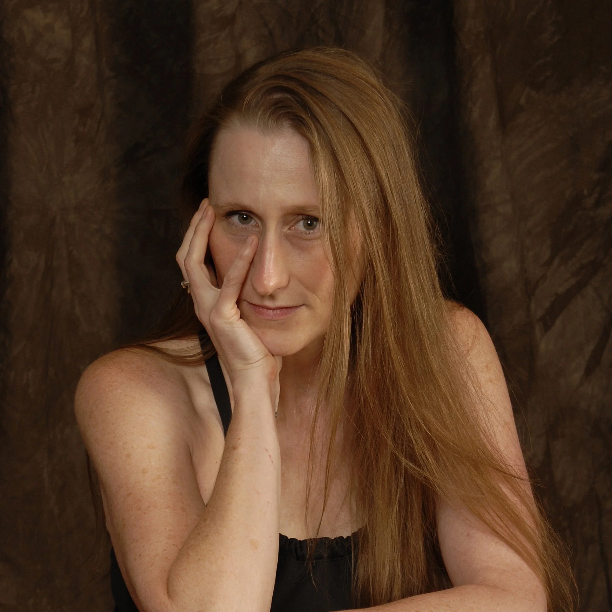 Amanda K. King, independent author, chin i n hand.