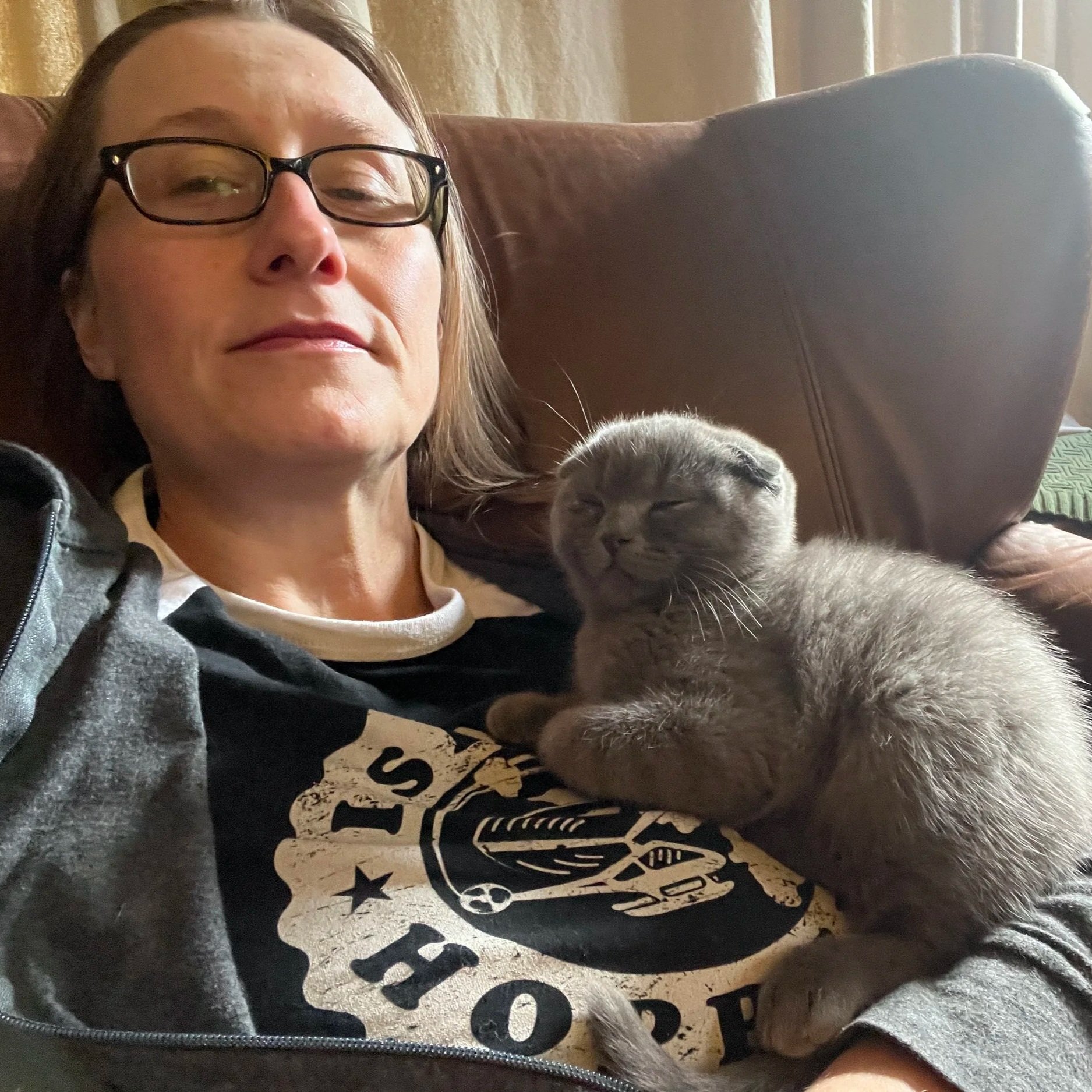 Amanda K. King, Independent author, with her kitten Binny, wearing an Island Hoppers shirt.