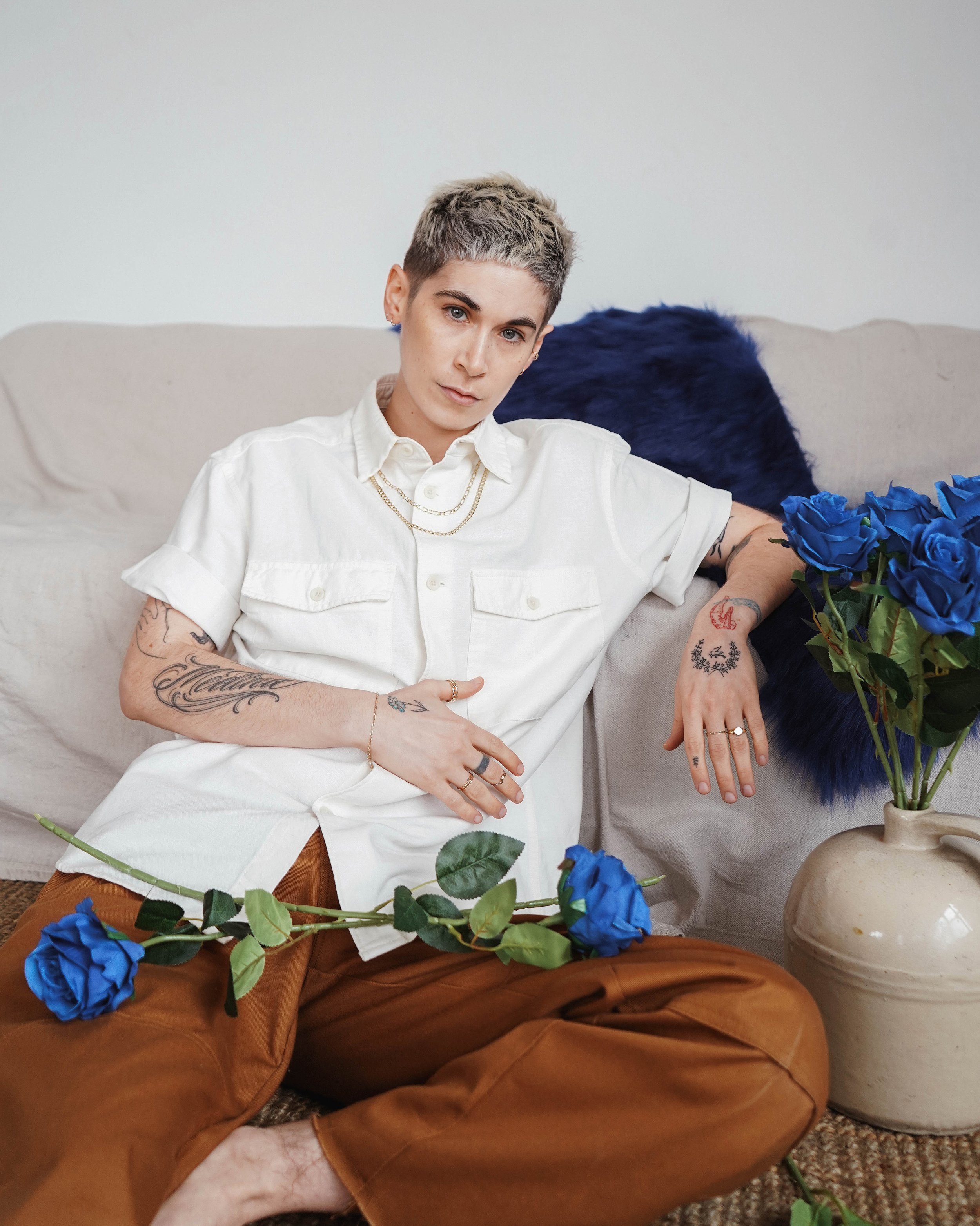 Studio portrait of a model showcasing jewellery with a clean, editorial fashion photography style.
