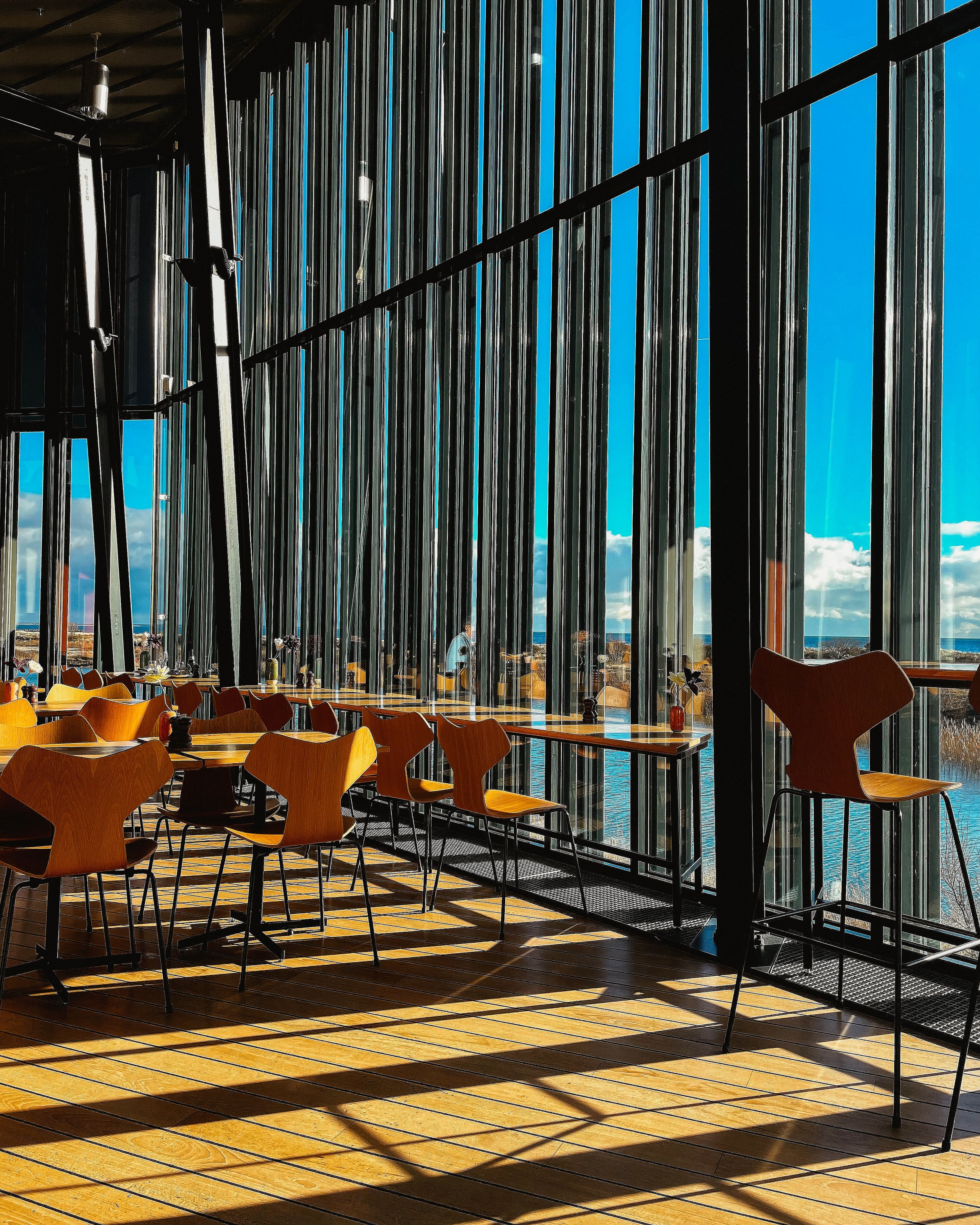 Restaurant interior photography captured by a Copenhagen-based photographer, focusing on spatial design, atmosphere, and natural light.