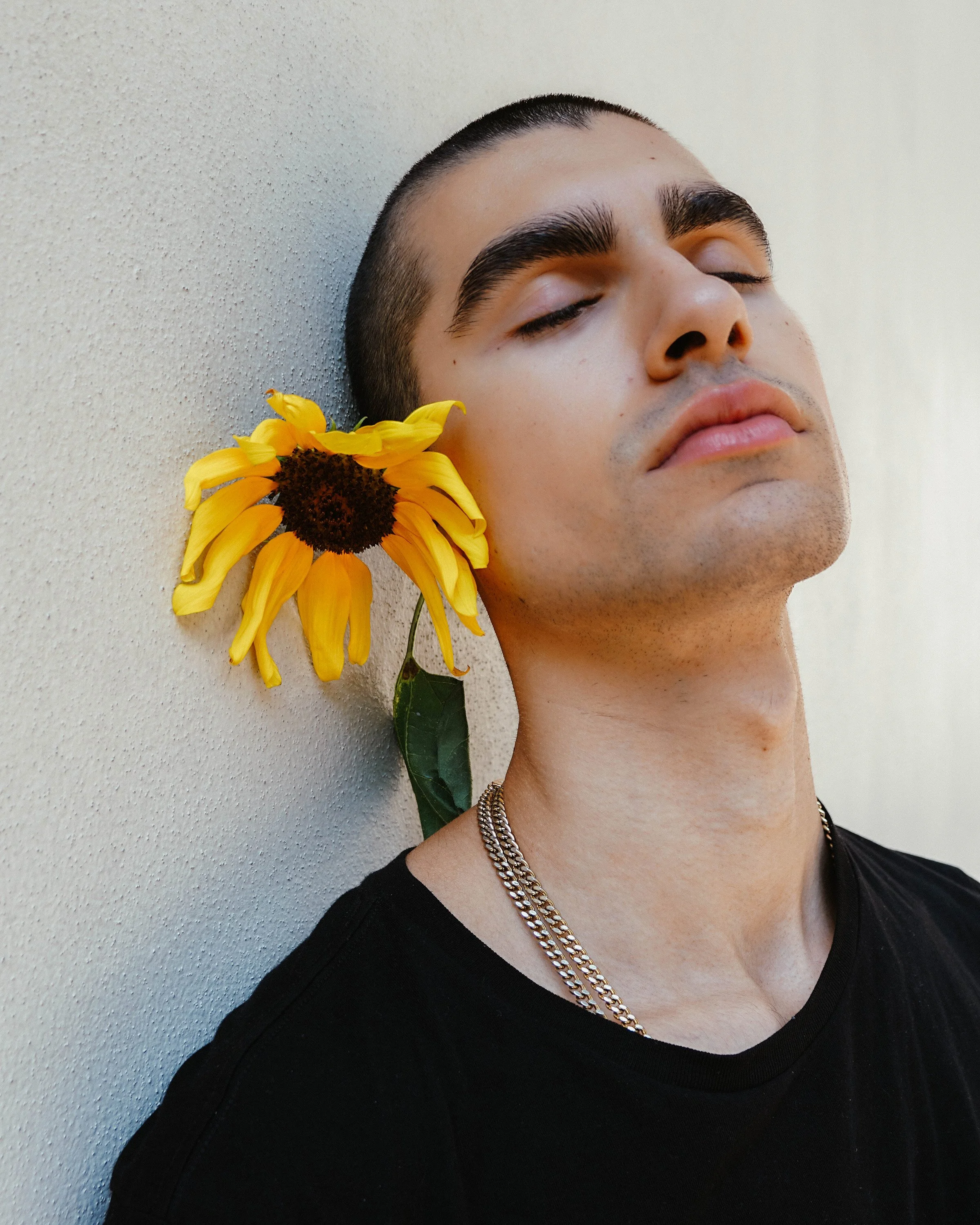 Studio editorial fashion photograph with cinematic lighting, professional styling, and contemporary model poses.